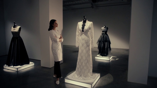 Video Reference: Sleeve, Automotive design, Art, Sculpture, Grey, Style, Fashion design, Event, Statue, Visual arts