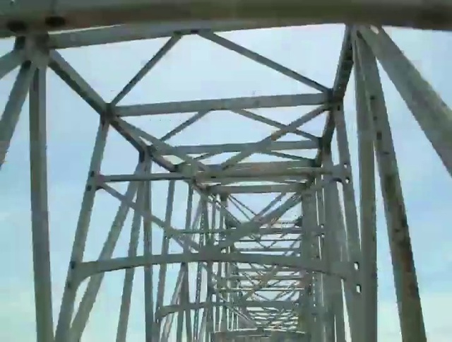 Video Reference: Sky, Cloud, Beam, Girder bridge, Truss bridge, Electricity, Engineering, Bridge, Symmetry, Public utility