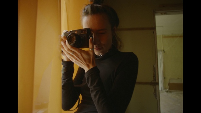 Video Reference: Shoulder, Photographer, Vision care, Digital camera, Camera lens, Reflex camera, Sleeve, Flash photography, Camera, Gesture