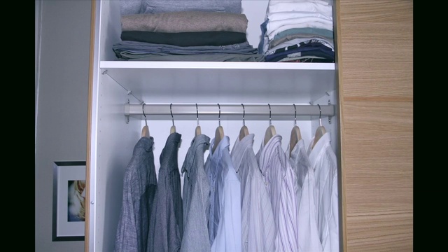 Video Reference: Jeans, Outerwear, Clothes hanger, Sleeve, Denim, Dress shirt, Rectangle, Plant, Fashion design, Animal product