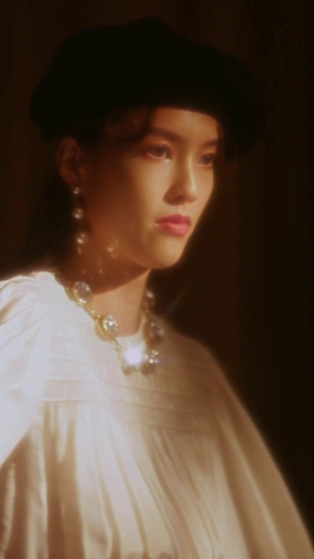 Video Reference: Hair, Skin, Lip, Chin, Hairstyle, Eyebrow, Eyelash, Dress, Flash photography, Lipstick