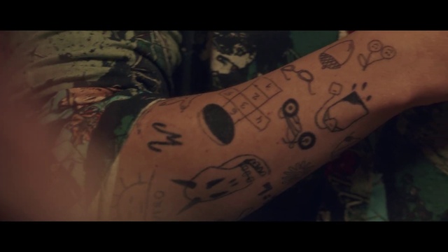 Video Reference: Joint, Human body, Sleeve, Elbow, Art, Tattoo, Font, Wrist, Human leg, Pattern