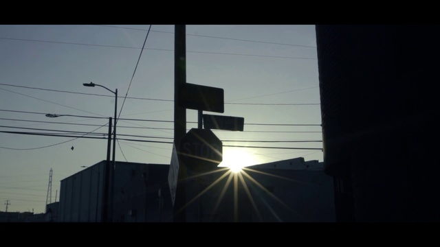 Video Reference: Sky, Atmosphere, Street light, Building, Sunlight, Window, Dusk, Electricity, Tints and shades, Overhead power line