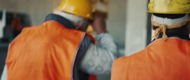 Video Reference: Hard hat, Workwear, Sleeve, Orange, Helmet, Gesture, Yellow, Headgear, Tradesman, Engineer