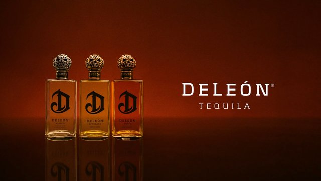 Video Reference: tequila, bottles, liquor, alcohol, product shot, branding, reflection, warm background, amber, glass bottle, luxury, advertisement