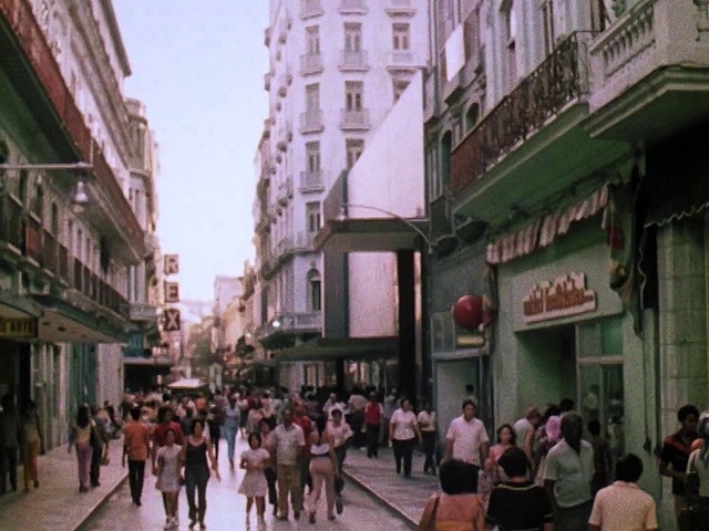 Video Reference: Building, Window, Infrastructure, Sky, Neighbourhood, Travel, City, Crowd, Road, House