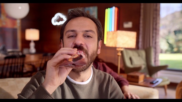 Video Reference: Clothing, Nose, Food, Mouth, Beard, Jaw, Gesture, Food craving, Flash photography, Alcoholic beverage