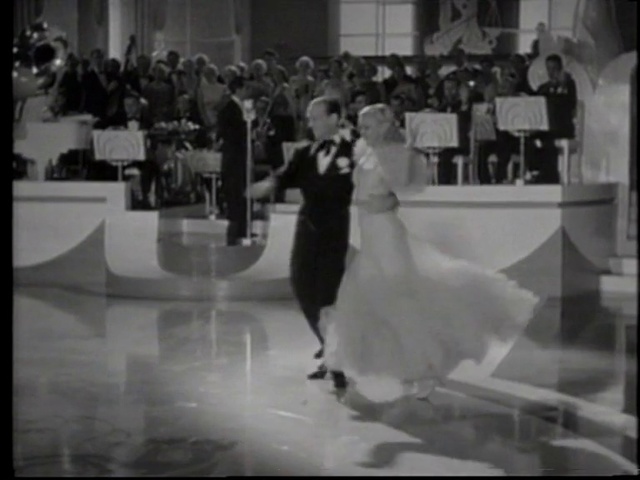 Video Reference: Wedding dress, Fashion, Flash photography, Standing, Black-and-white, Gesture, Flooring, Style, Happy, Entertainment