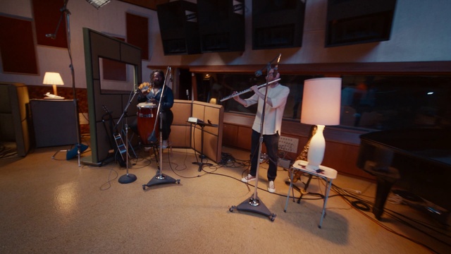 Video Reference: Tripod, Building, Musical instrument, Musician, Couch, Musical instrument accessory, Entertainment, Audio equipment, Music, Microphone