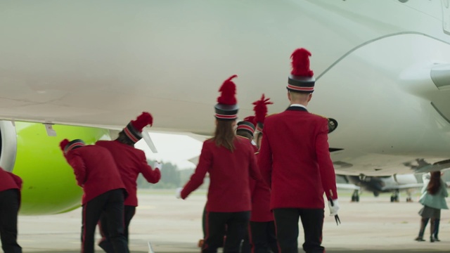 Video Reference: Outerwear, Gesture, Headgear, Cap, Event, Freezing, Aerospace manufacturer, Hat, Ice rink, Team