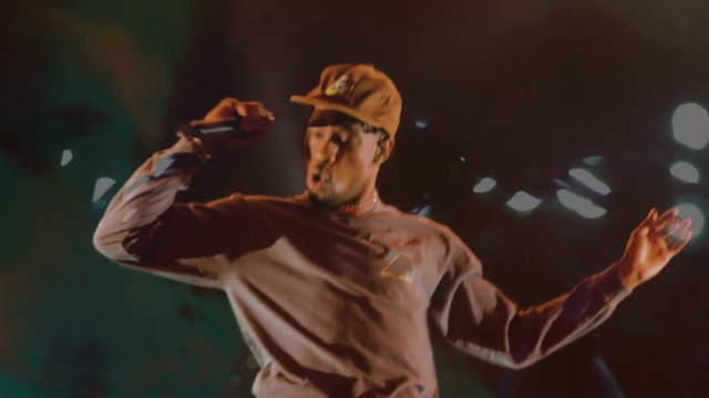 Video Reference: Arm, Hat, Gesture, Artist, Elbow, Music artist, Music, Performing arts, Baseball cap, Entertainment