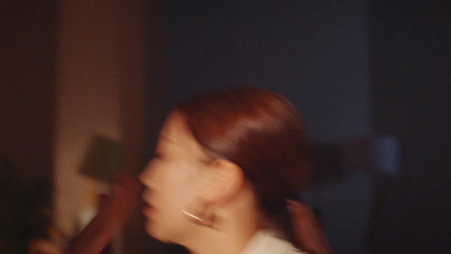 Video Reference: Cheek, Eyelash, Jaw, Neck, Ear, Gesture, Flash photography, Darkness, Brown hair, Event