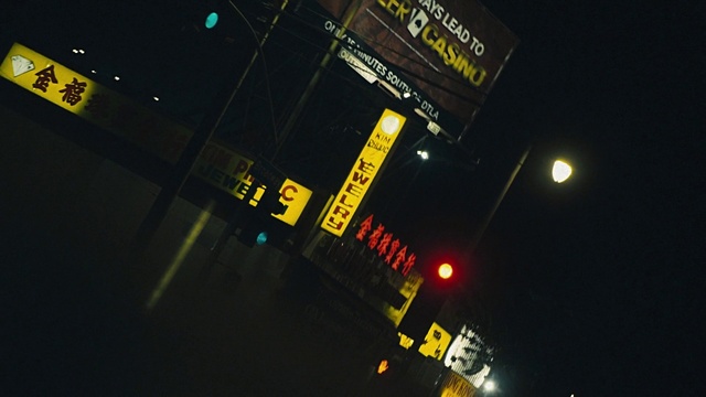 Video Reference: Amber, Automotive lighting, Font, Electricity, City, Building, Metropolis, Midnight, Space, Signage