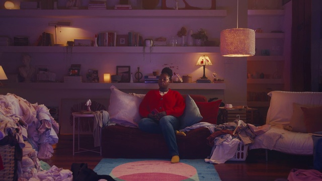 Video Reference: Property, Comfort, Purple, Picture frame, Interior design, Living room, Violet, Lamp, Floor, Wall