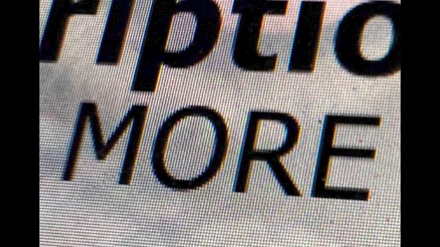 Video Reference: close-up, screen, text, letters, white background, black text, display, pixelated, cropped, zoomed in, typography, interface