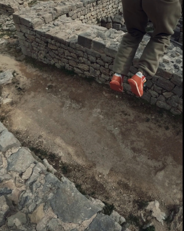 Video Reference: Road surface, Bedrock, Wall, Flooring, Brickwork, Brick, Asphalt, Composite material, Human leg, Soil