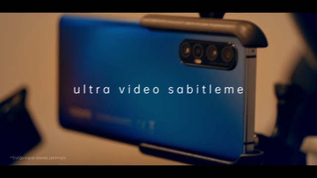 Video Reference: Azure, Communication Device, Gadget, Material property, Gas, Font, Electric blue, Cameras & optics, Multimedia, Camera