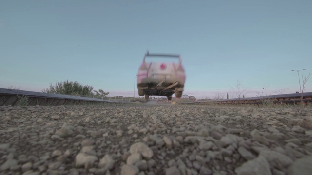 Video Reference: Land vehicle, Sky, Vehicle, Plant, Ecoregion, Automotive lighting, Motor vehicle, Road surface, Asphalt, Rolling