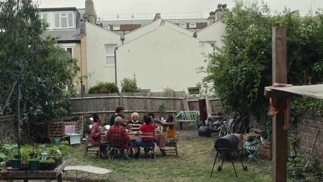Video Reference: Plant, Building, Chair, Window, Tree, Grass, Social group, Table, Sky, House