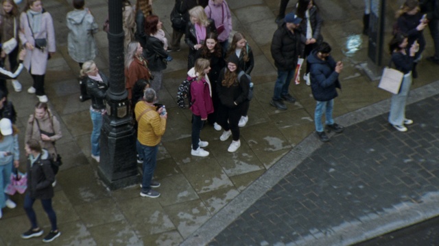 Video Reference: Footwear, Trousers, Shoe, Road, Sidewalk, Leisure, City, Event, Road surface, Fun