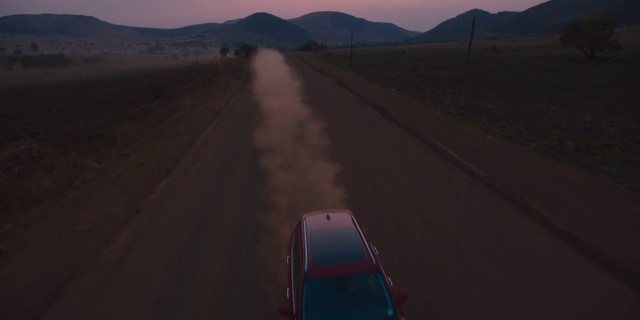 Video Reference: Sky, Mountain, Natural environment, Road surface, Asphalt, Vehicle, Mode of transport, Atmospheric phenomenon, Thoroughfare, Landscape