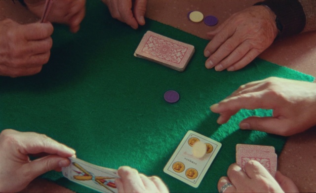Video Reference: Hand, Table, Green, Finger, Nail, Gesture, Thumb, Wood, Indoor games and sports, Red