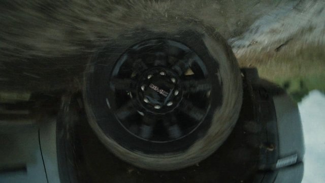 Video Reference: wheel, tire, off-road, vehicle, rotation, motion blur, mud, dirt, close-up, driving, rim, automotive, 4x4, terrain