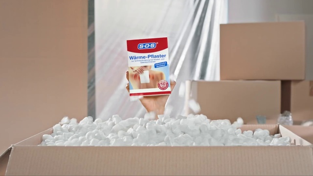 Video Reference: Gesture, Rectangle, Shipping box, Font, Packing materials, Carton, Packaging and labeling, Carmine, Advertising, Brick