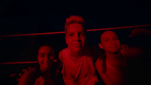 Video Reference: Smile, Flash photography, T-shirt, Magenta, Entertainment, Hat, Event, Cap, Electric blue, Fun