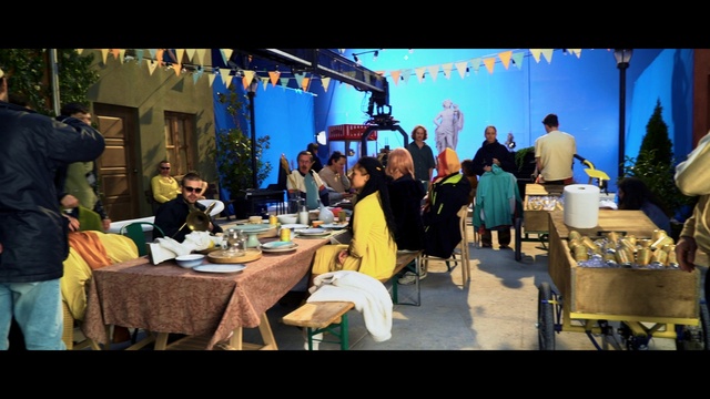 Video Reference: Table, Sharing, Tableware, Chair, Adaptation, Leisure, Food, Event, Tablecloth, Suit