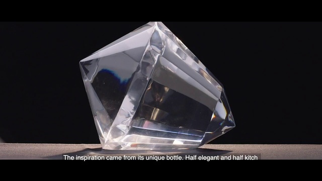 Video Reference: Triangle, Rectangle, Automotive design, Art, Automotive lighting, Font, Jewellery, Electric blue, Crystal, Glass