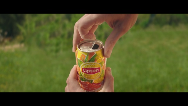 Video Reference: Hand, Gesture, People in nature, Grass, Finger, Tin can, Drink, Thumb, Beverage can, Happy