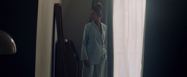 Video Reference: Dress shirt, Sleeve, Hat, Grey, Curtain, Blazer, Formal wear, Fashion design, White-collar worker, Street fashion