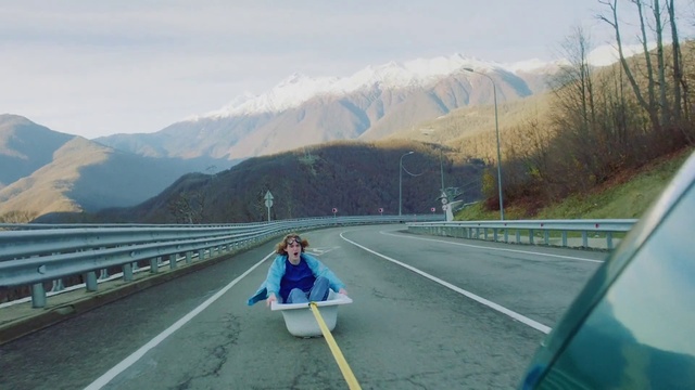 Video Reference: Sky, Cloud, Mountain, Infrastructure, Road surface, Asphalt, Slope, Plant, Highland, Mode of transport