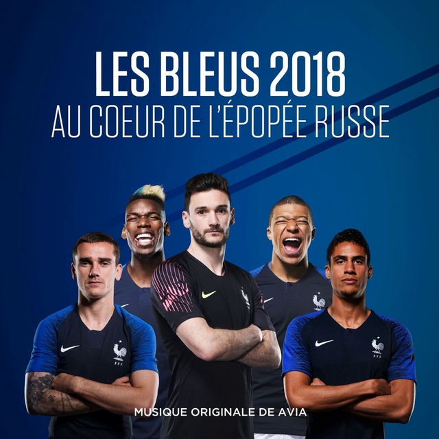 Video Reference: Smile, Sleeve, Gesture, Font, T-shirt, Happy, Team, Electric blue, Event, Photo caption
