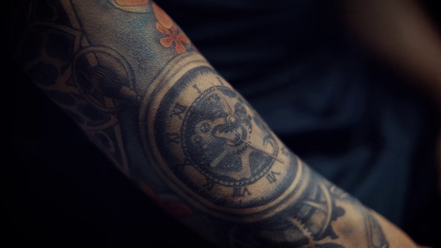 Video Reference: Sleeve, Elbow, Temporary tattoo, Font, Human leg, Tree, Tattoo, Pattern, Close-up, Wrist