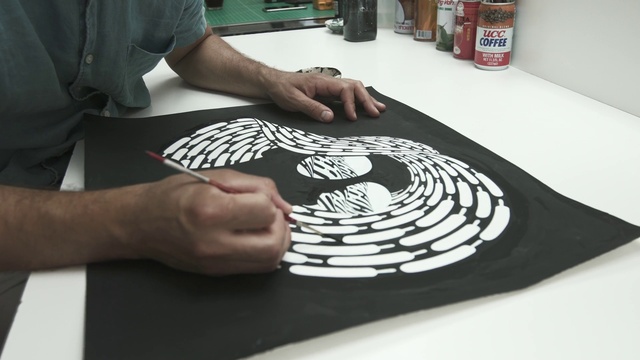 Video Reference: Hand, Table, Automotive design, Gesture, Finger, Art, Font, T-shirt, Cabinetry, Recreation