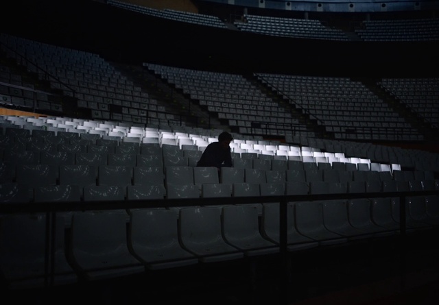 Video Reference: Field house, Sky, Building, Arena, Darkness, Font, Sport venue, Stadium, Event, Pattern