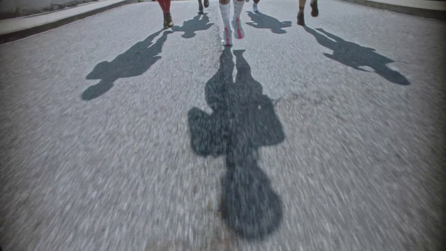 Video Reference: Road surface, Asphalt, Tar, Tree, Snapshot, Sidewalk, Road, Human leg, Event, City