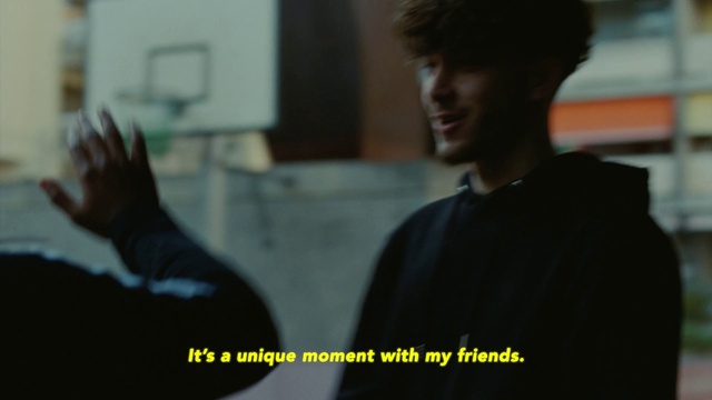 Video Reference: Forehead, Jaw, Gesture, Sleeve, White-collar worker, Fun, Font, Event, Conversation, T-shirt