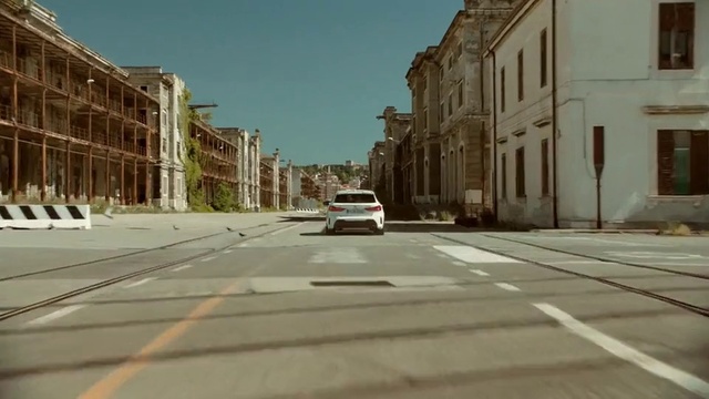 Video Reference: Building, Car, Window, Daytime, Sky, Vehicle, Road surface, Asphalt, Tire, Motor vehicle