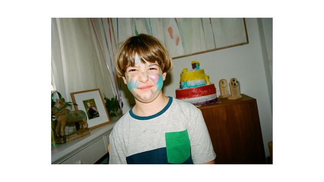 Video Reference: Happy, T-shirt, Smile, Room, Sitting, Cooking, Birthday cake, Dessert, Baking, Bangs