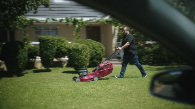 Video Reference: Lawn mower, Plant, Wheel, Walk-behind mower, Tire, Mower, Building, Grass, Window, Motor vehicle