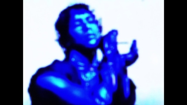 Video Reference: Human body, Gesture, Electric blue, Thumb, Music artist, Art, Flash photography, Entertainment, Elbow, Event
