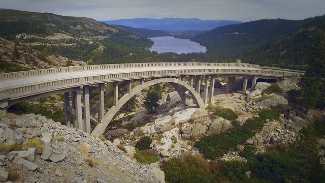 Video Reference: Sky, Mountain, Water, Plant, Natural landscape, Arch bridge, Bridge, Landscape, Aqueduct, Road