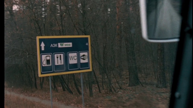 Video Reference: Plant, Wood, Tree, Motor vehicle, Natural landscape, Traffic sign, Gas, Landscape, Font, Forest