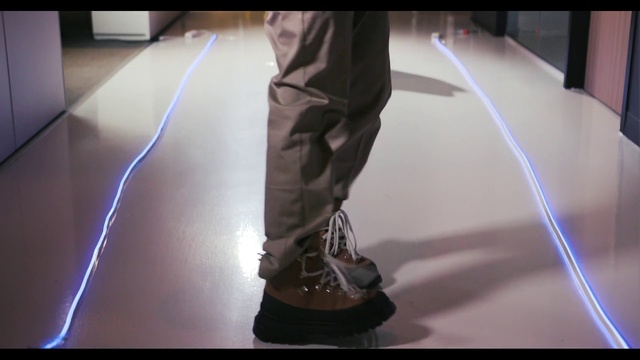 Video Reference: Joint, Standing, Flooring, Floor, Thigh, Gadget, Entertainment, Audio equipment, Knee, Elbow