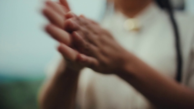 Video Reference: Gesture, Ear, Thumb, Wrist, Eyelash, Nail, Event, Pray, Flesh, Peach