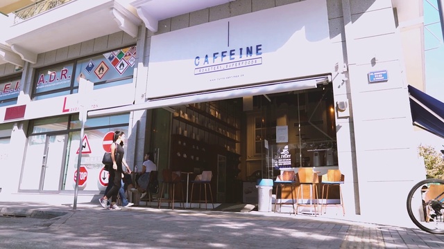 Video Reference: Building, Facade, Door, Retail, Font, City, Commercial building, Mixed-use, Street, Awning