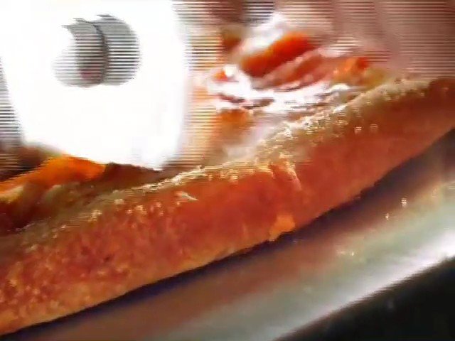 Video Reference: food, close-up, baked, roasted, tray, plate, cooking, hand, utensil, restaurant, recipe, meal, brown, texture, indoor